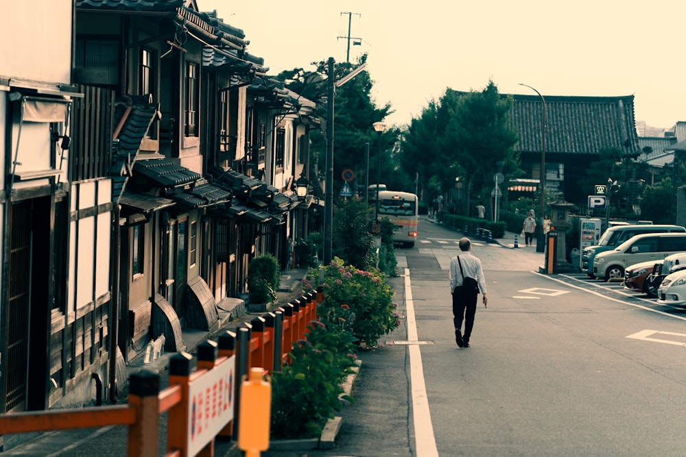 a person walking down a sidewalk