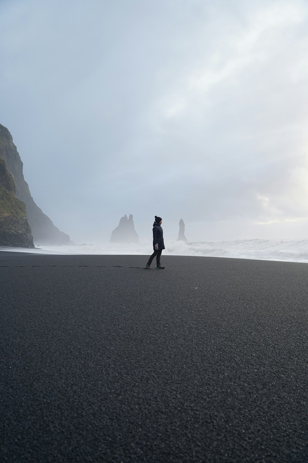 a person walking on a beach