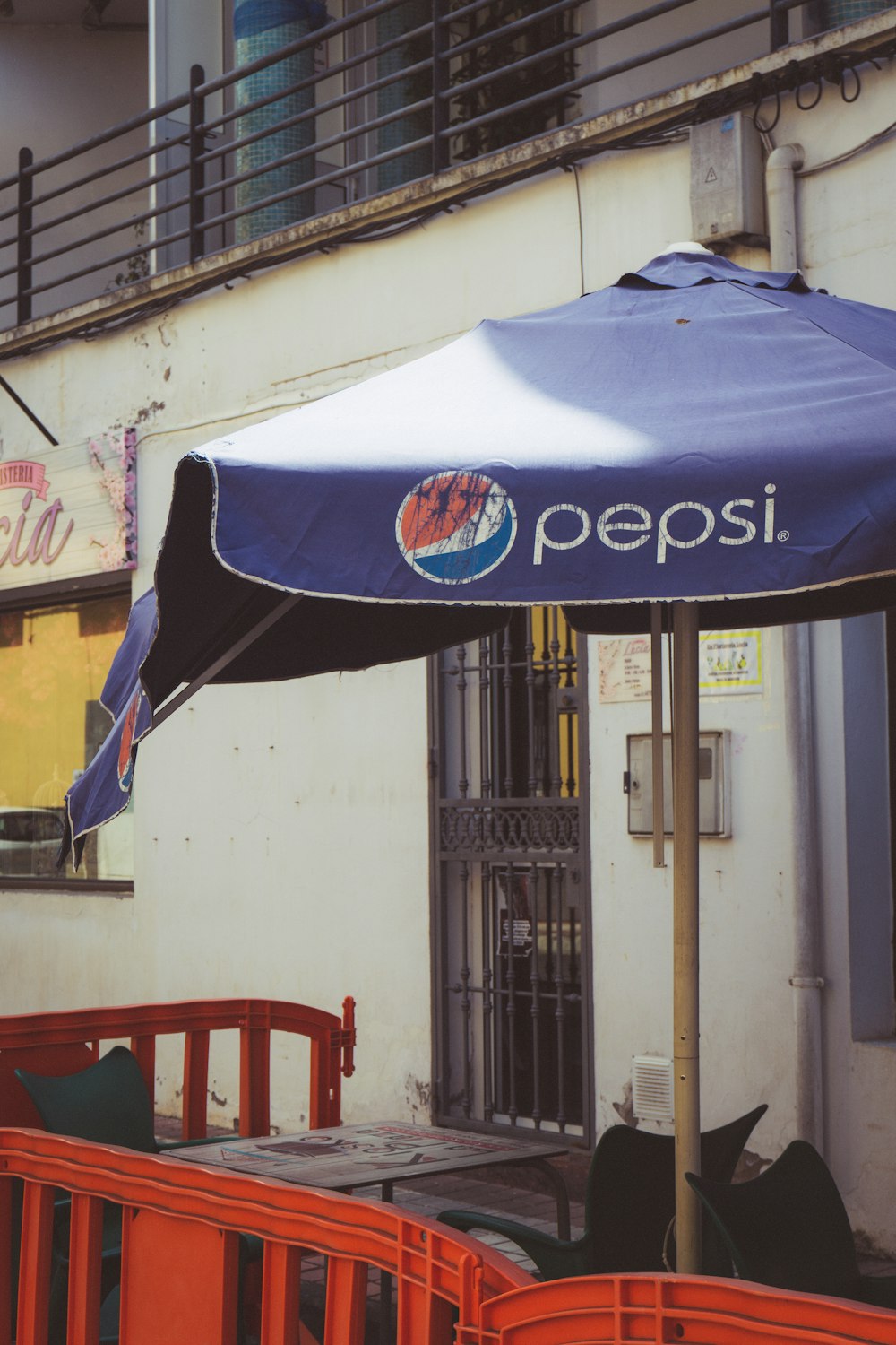 a couple of umbrellas sit outside of a building