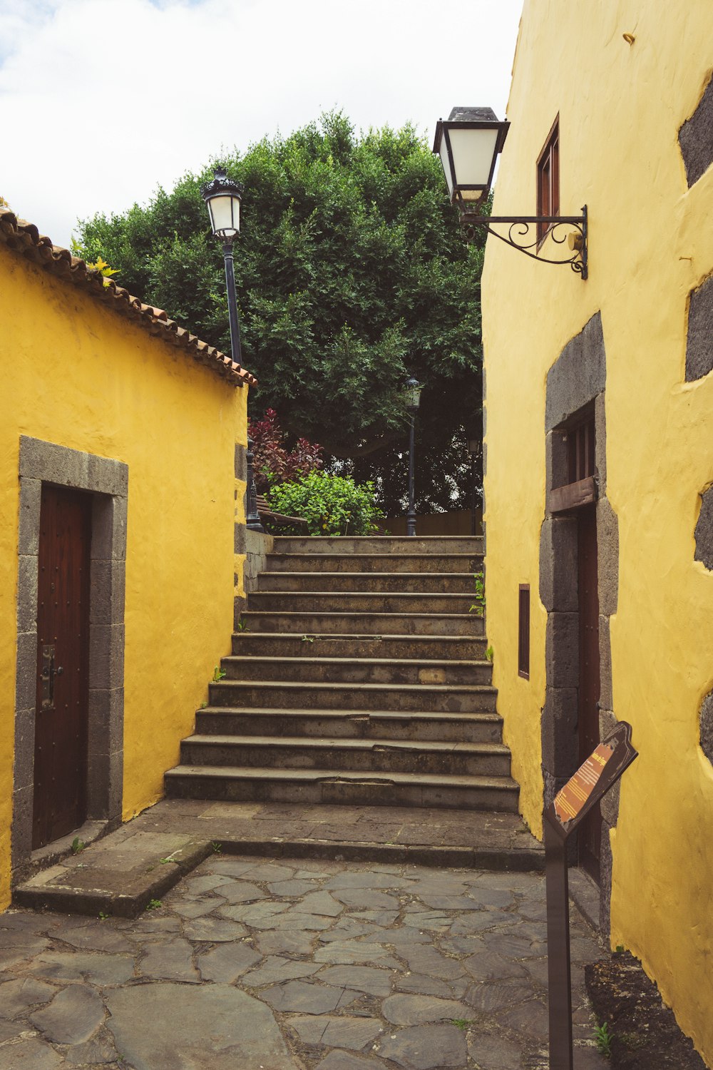 a stone path between buildings