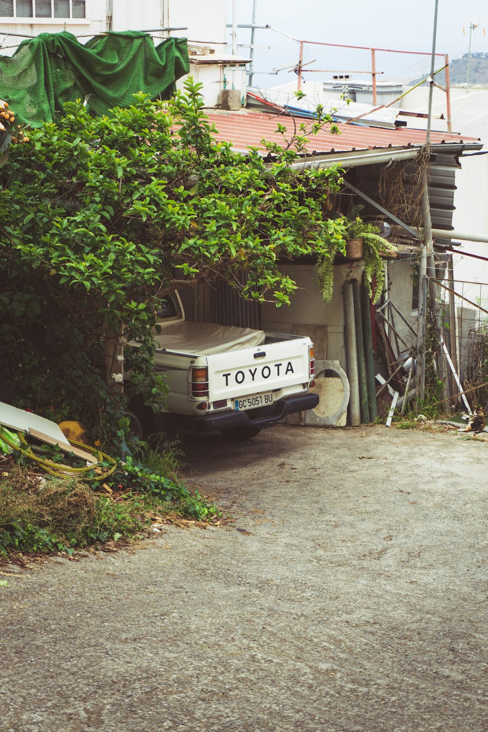 a white truck parked in front of a house