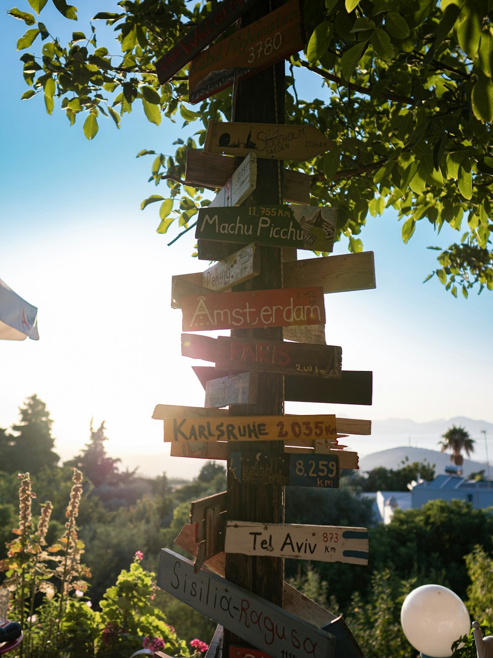 a sign post with many street signs