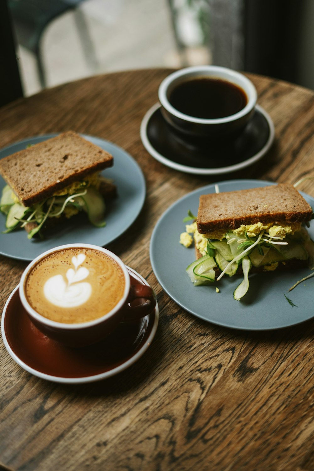 a sandwich and a cup of coffee