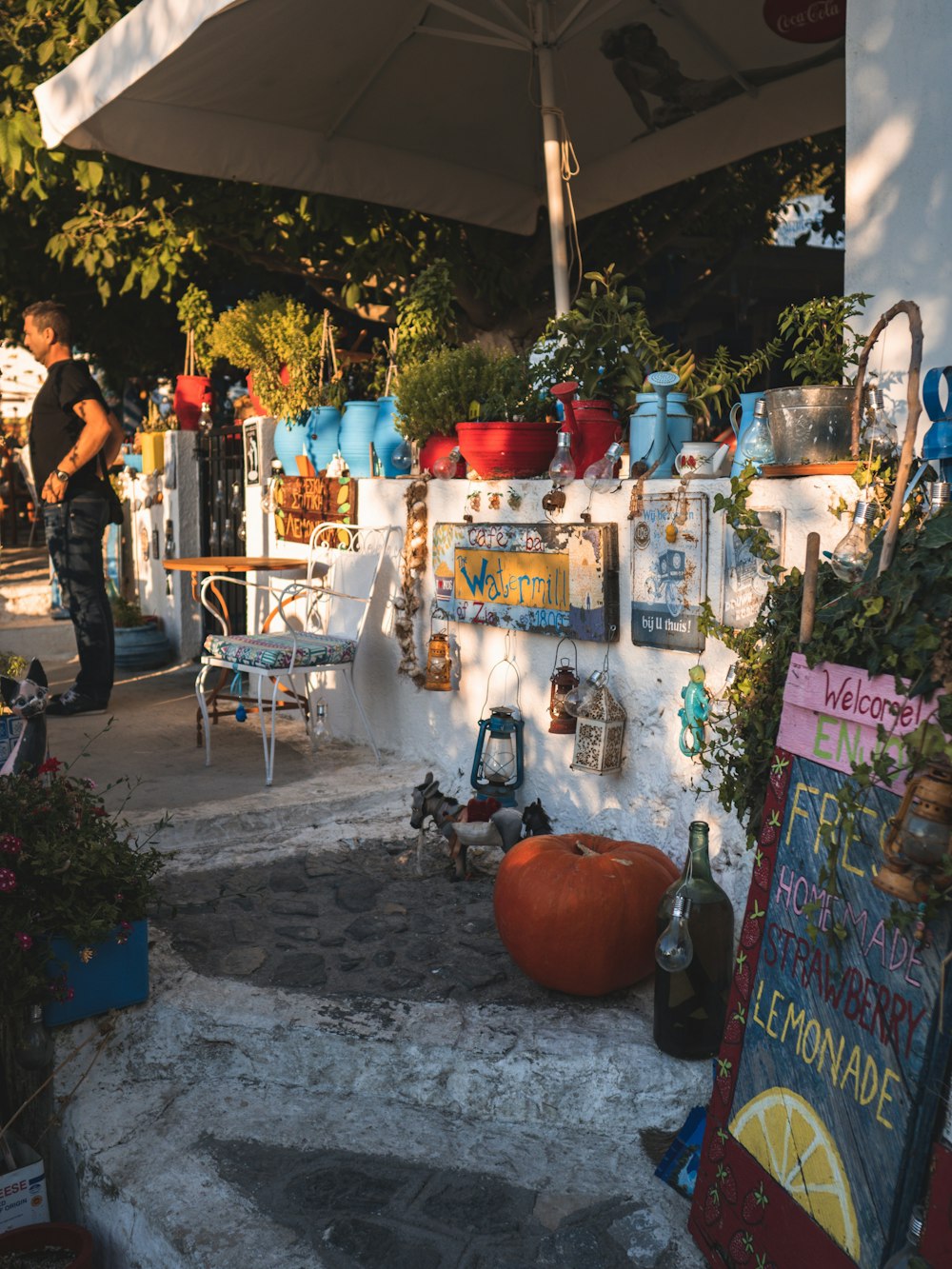 a person standing next to a shop