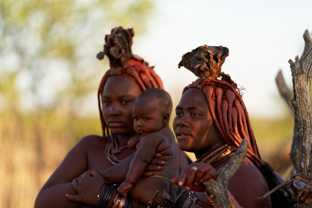 a person carrying a baby