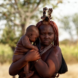 a person carrying a baby