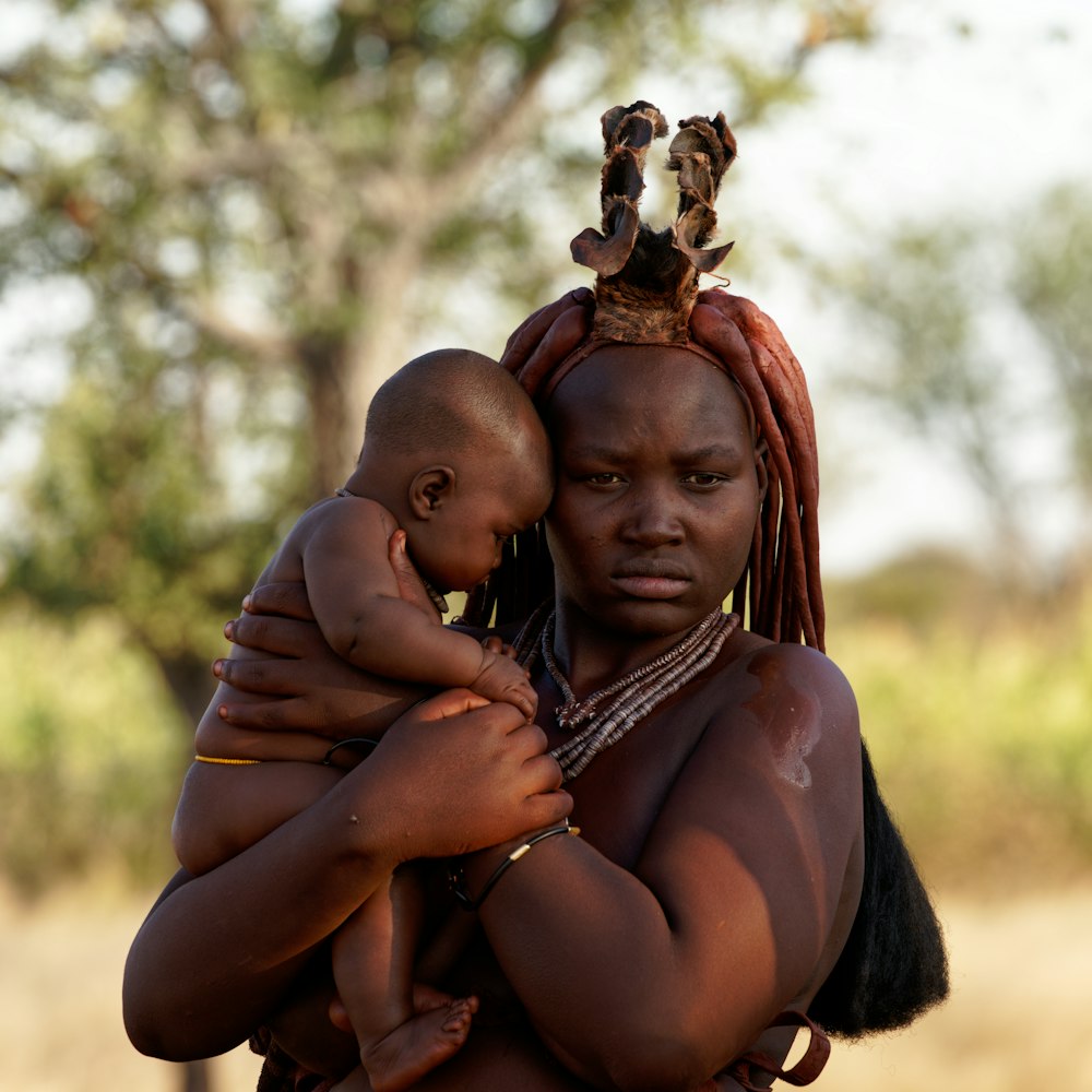 a person carrying a baby
