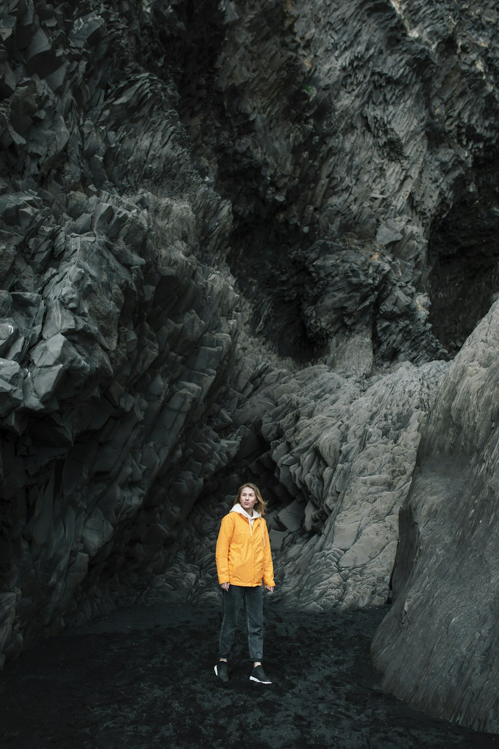 a person standing in a cave