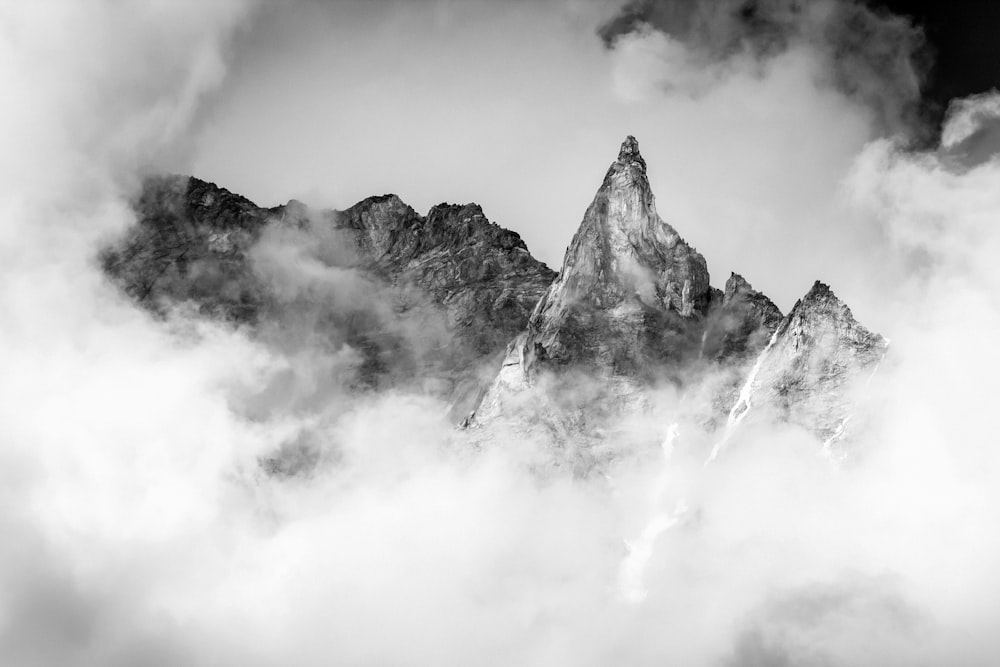 a mountain with clouds around it