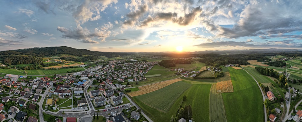 a large green landscape with buildings and roads