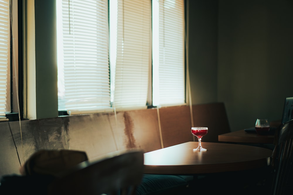 a glass of wine on a table