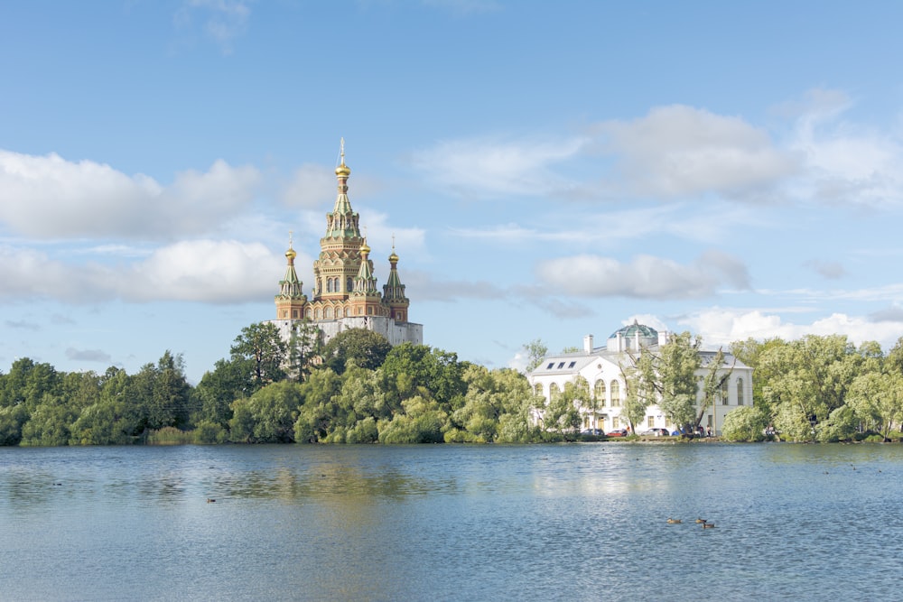 a building on a hill by water