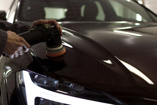 a person taking a picture of a car