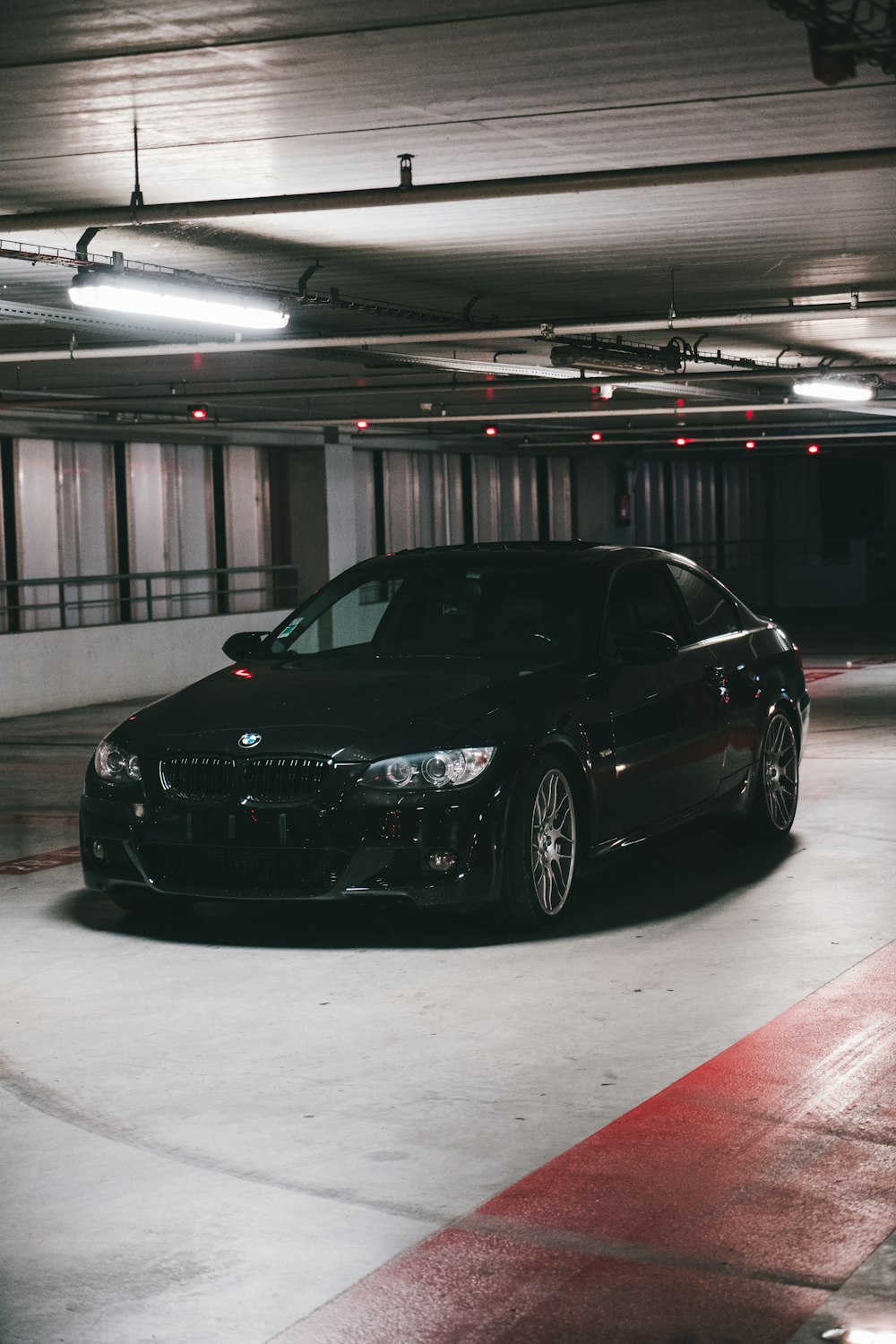 a black car parked in a garage