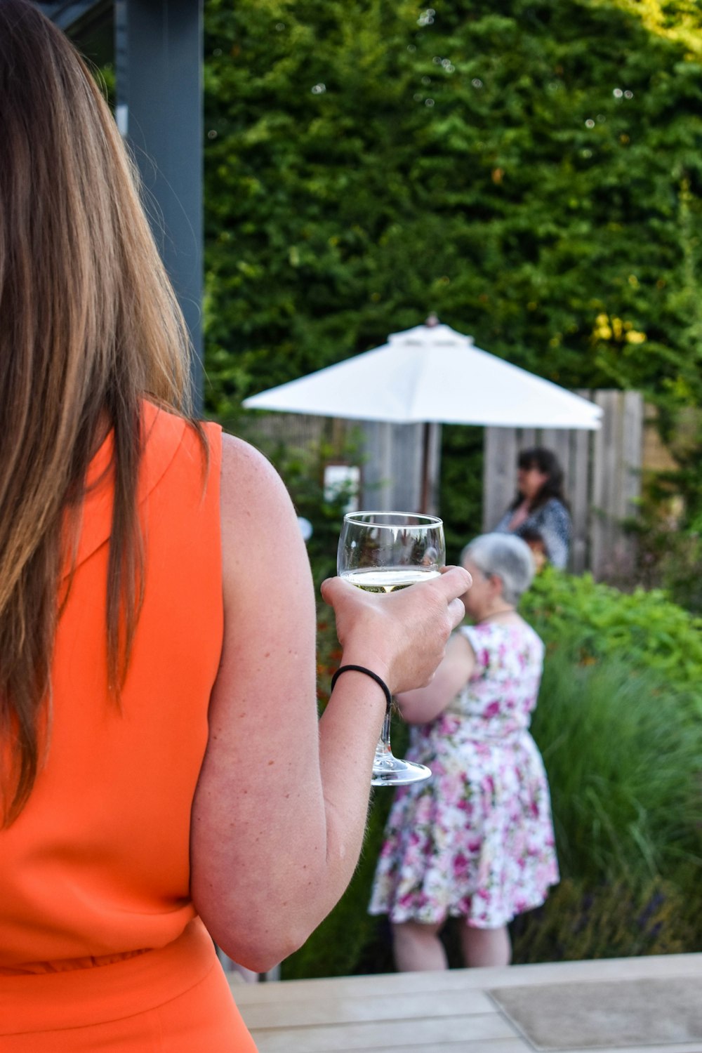 a woman holding a glass of wine