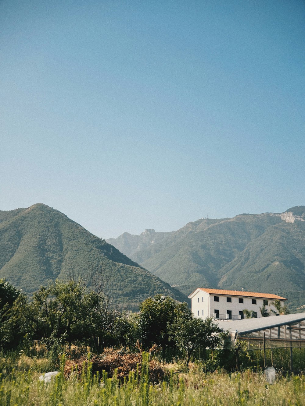 a house in front of a mountain