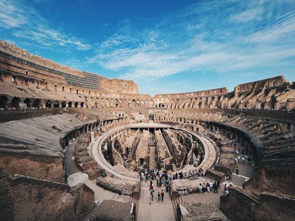 a large circular structure with people around it