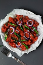 a plate of authentic chicken 65 , plating photo