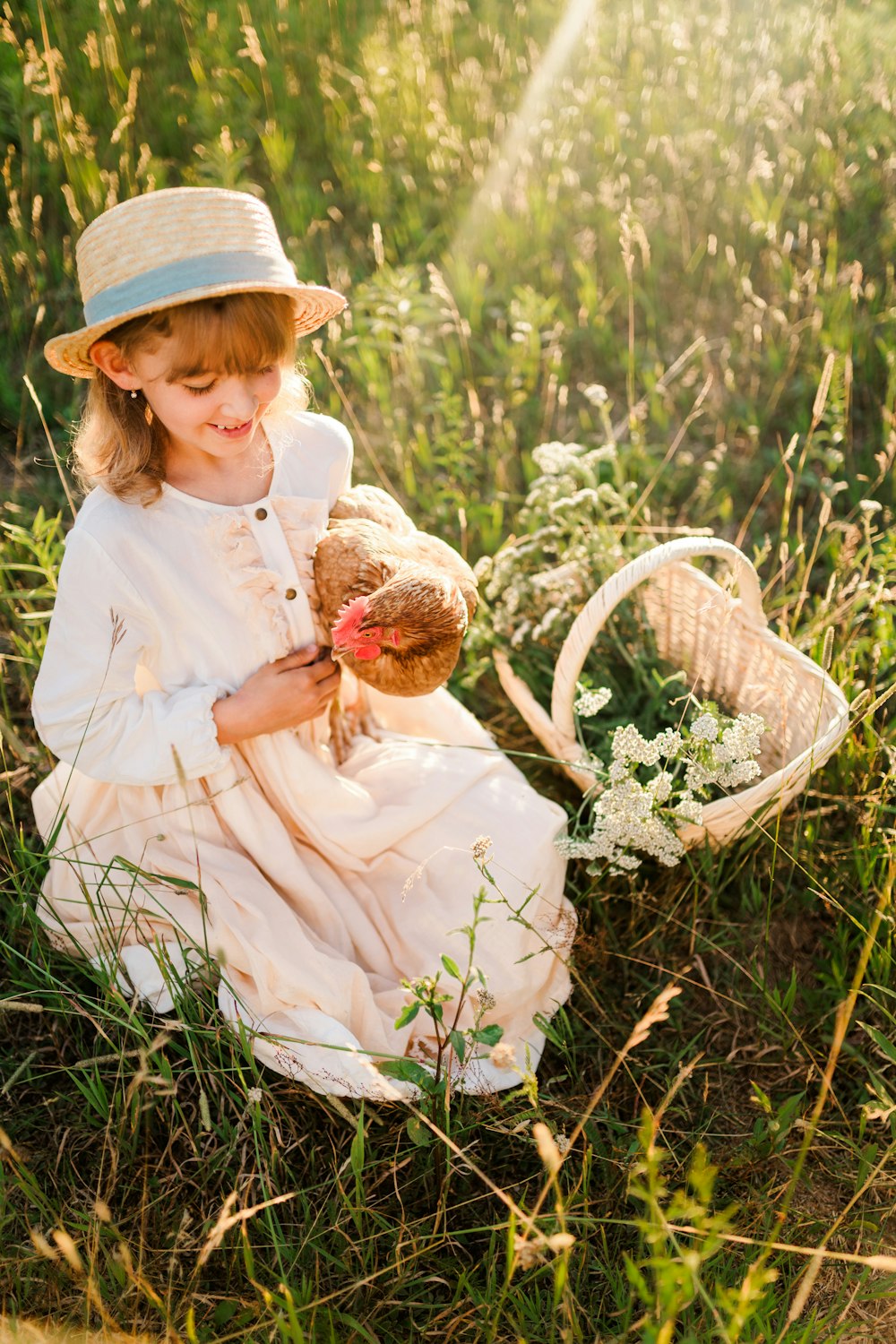 a little girl holding a teddy bear