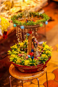 A variety of Aquafelis fountains displayed on a wooden shelf, highlighting different designs and colors.