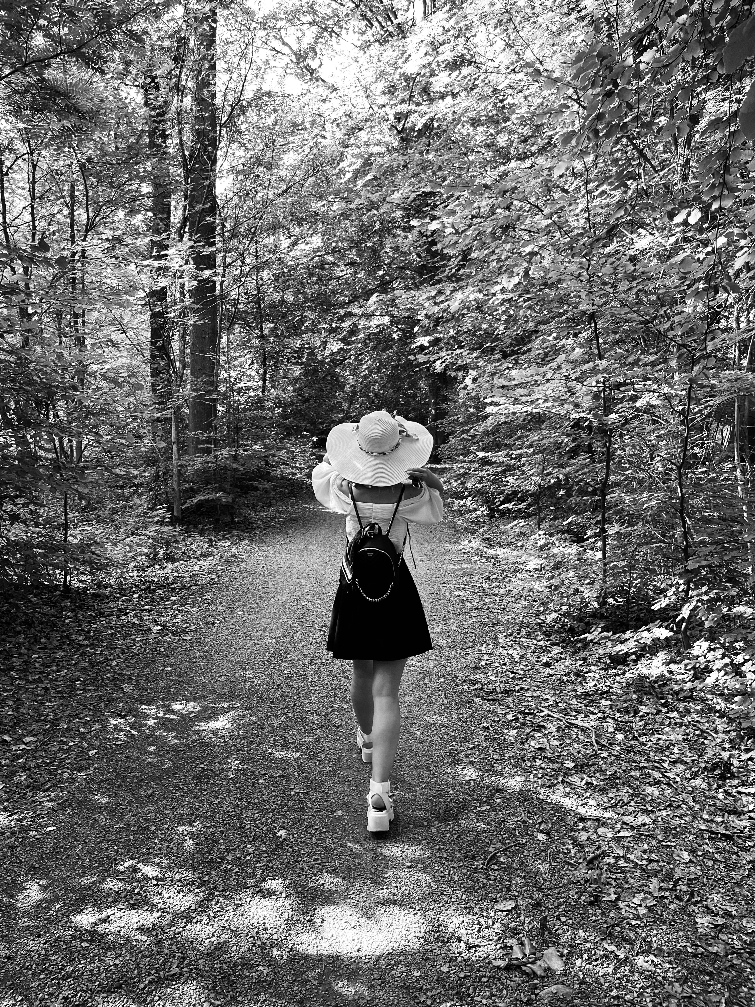 a-woman-walking-down-a-path-photo-free-helsingborg-image-on-unsplash