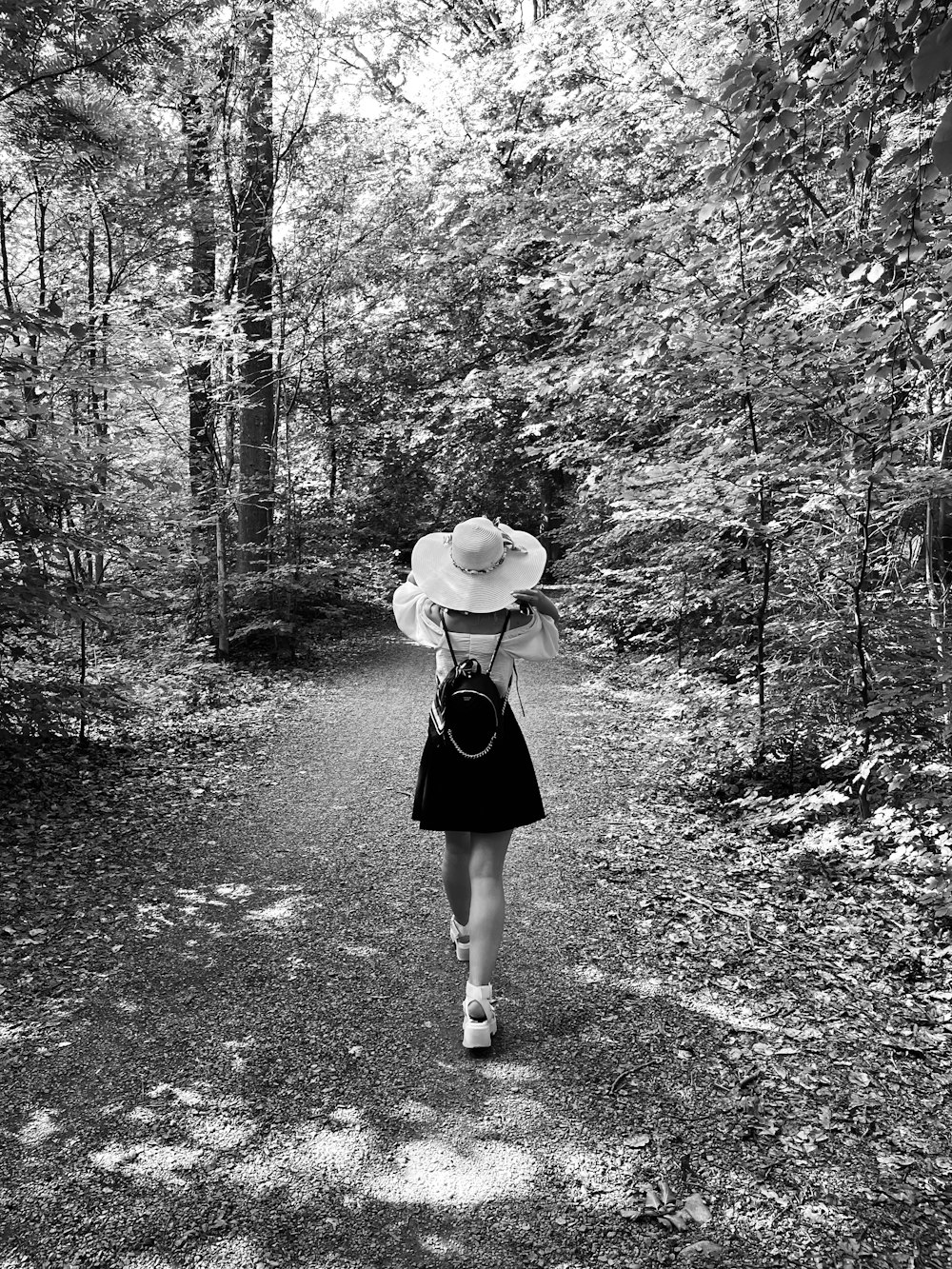 a woman walking down a path