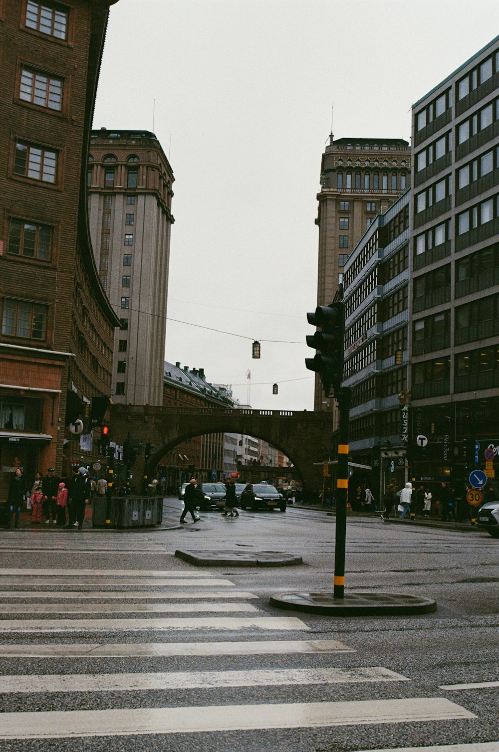 a city street with a bridge