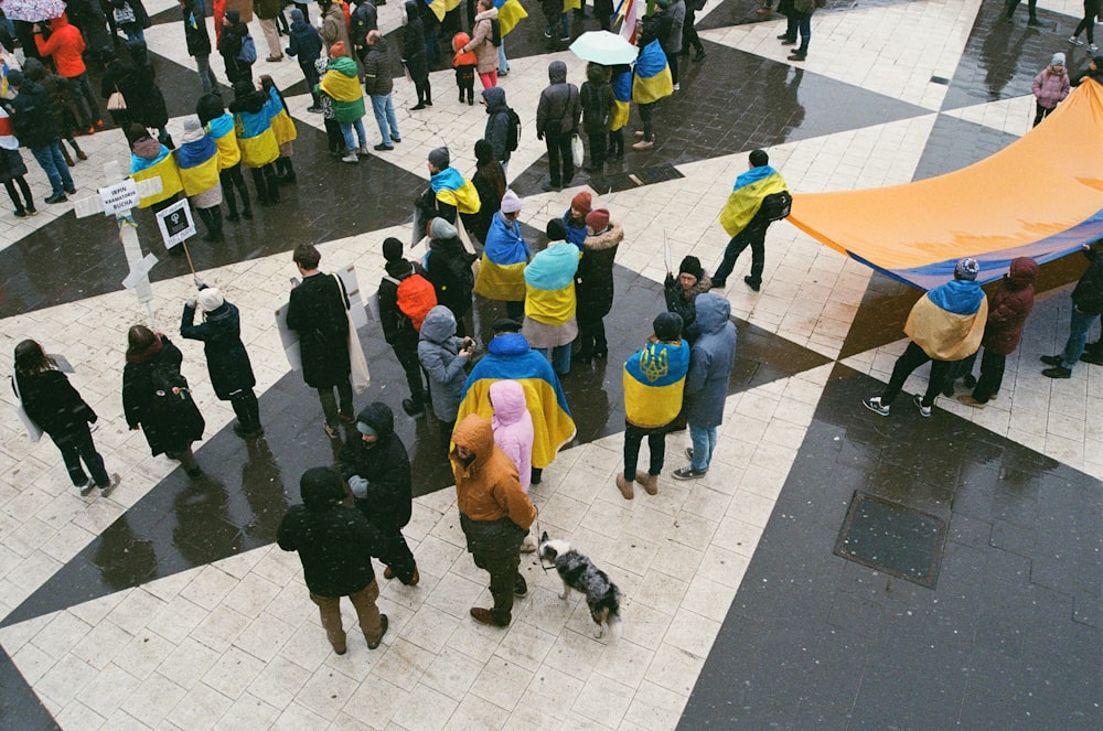 a group of people standing on the street