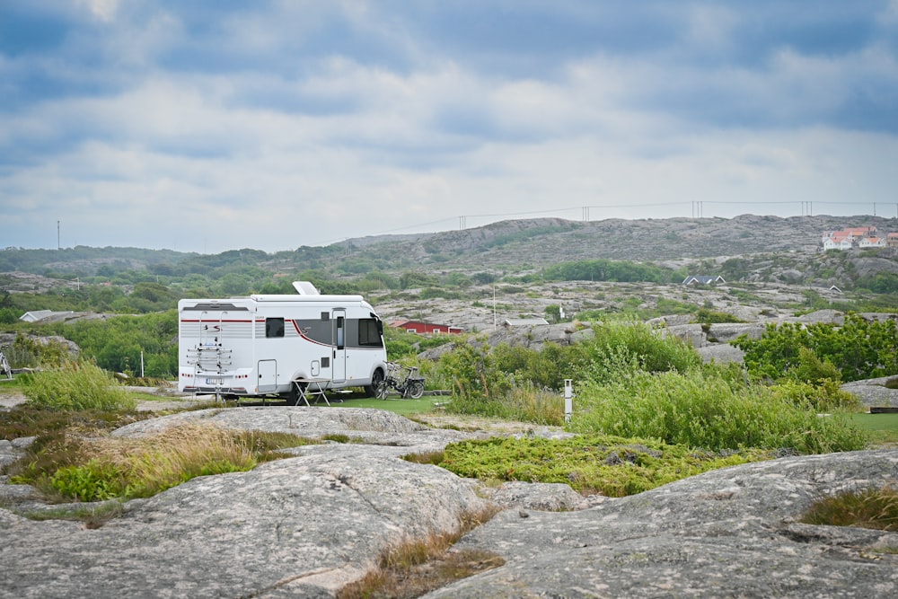 a white rv on a road