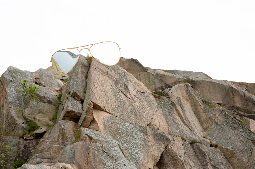 a rock formation with a car on it