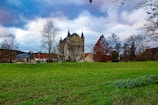 a castle with a grass field