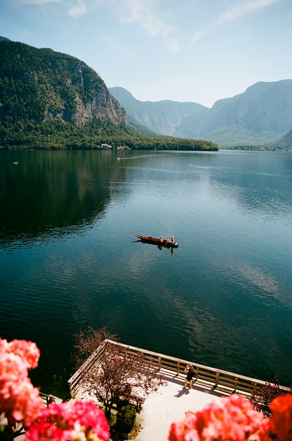 a body of water with a dock and a boat in it