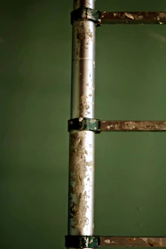 Close-up of a sturdy fiberglass sliding ladder with a smooth finish.