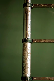 Close-up of a sturdy fiberglass sliding ladder with a smooth finish.