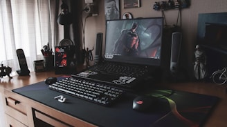 a laptop sits on top of a desk