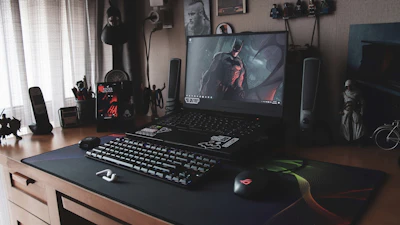 a laptop sits on top of a desk