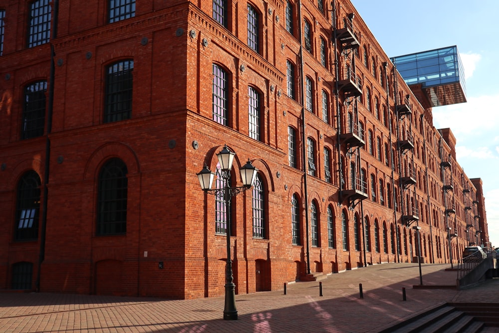 a brick building with a street light