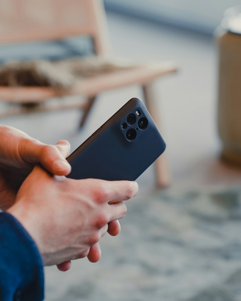 a person holding a black device