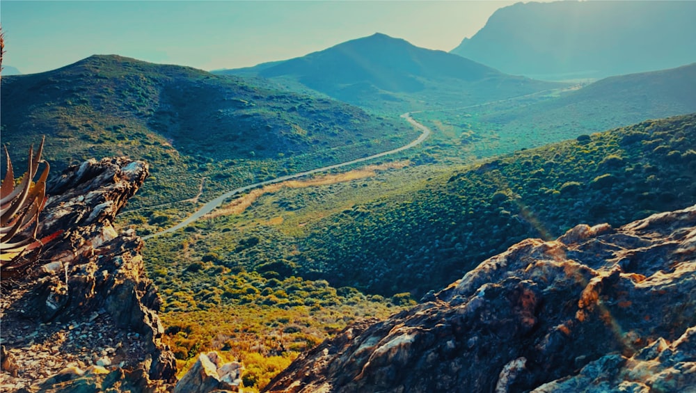 a winding road through a valley