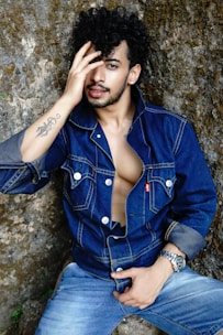 a person sitting on a rock