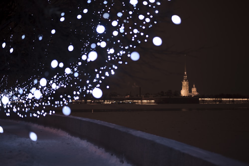 a city landscape with snow falling