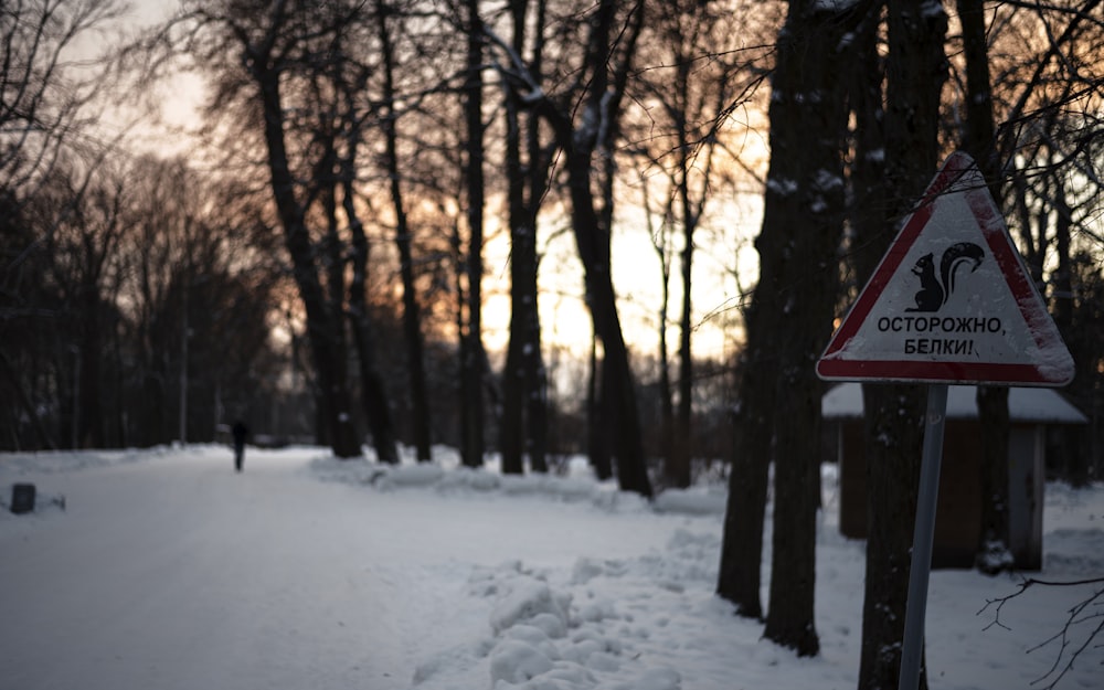 a sign on a snowy road