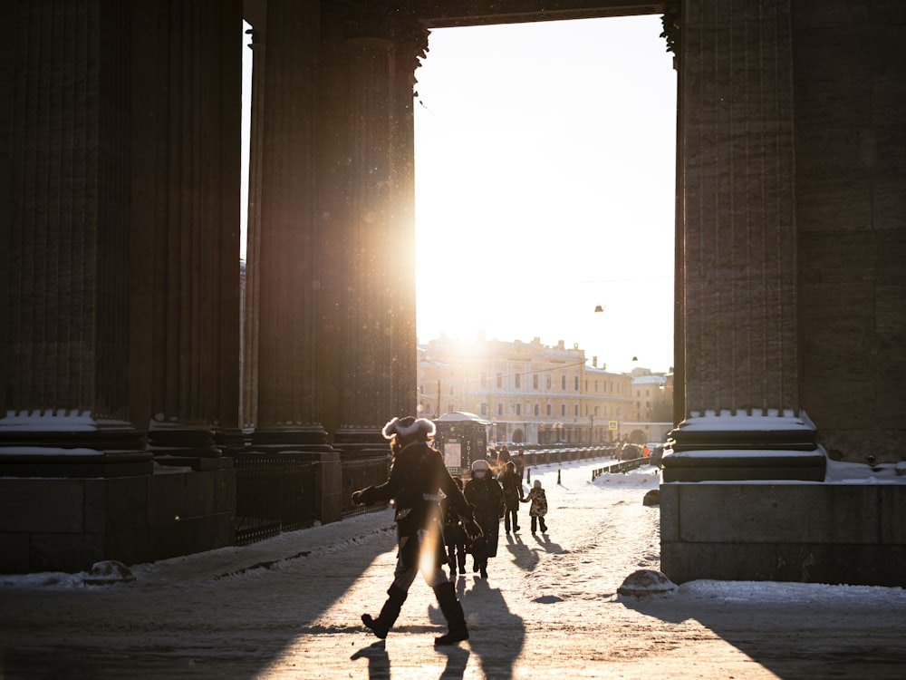 a group of people walking through a city