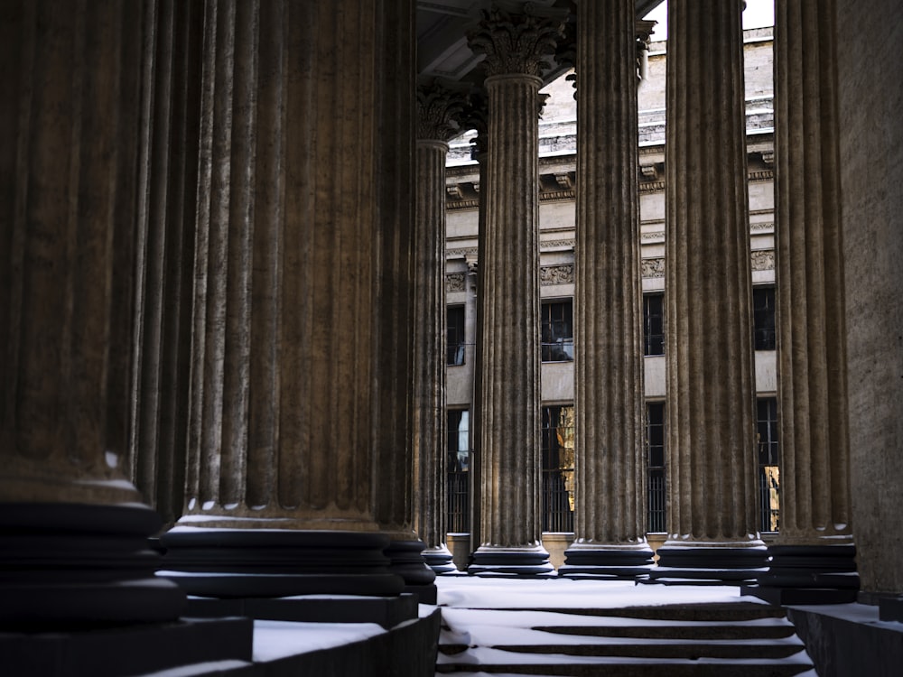 a room with tall pillars