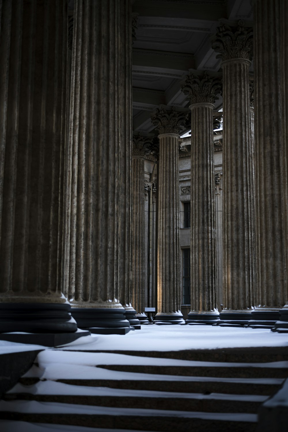 a large room with tall pillars