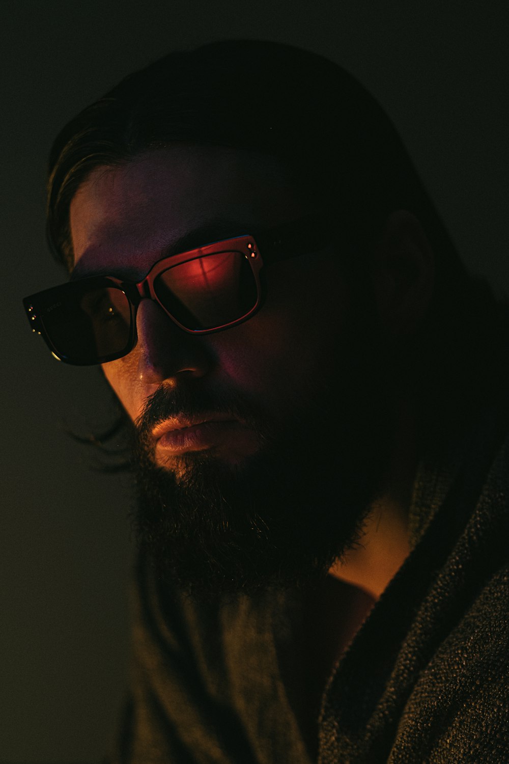 a man with a beard and glasses