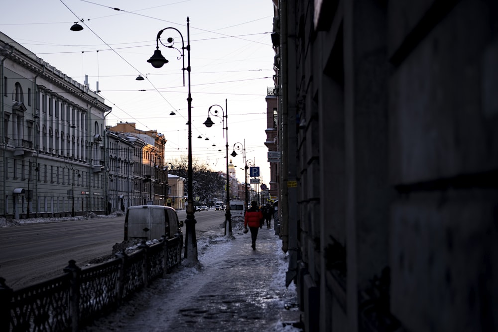 a person walking down a snowy street