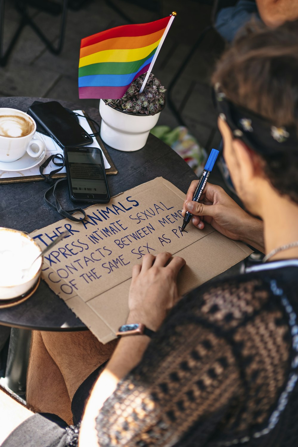 a person writing on a piece of paper