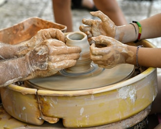 a person pouring a liquid into a cup