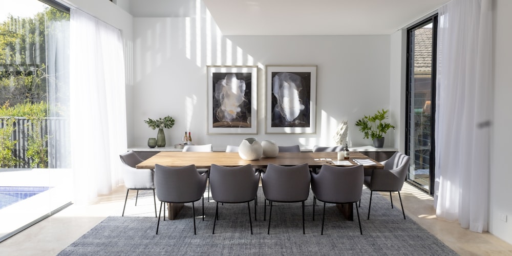 a dining room table with chairs around it